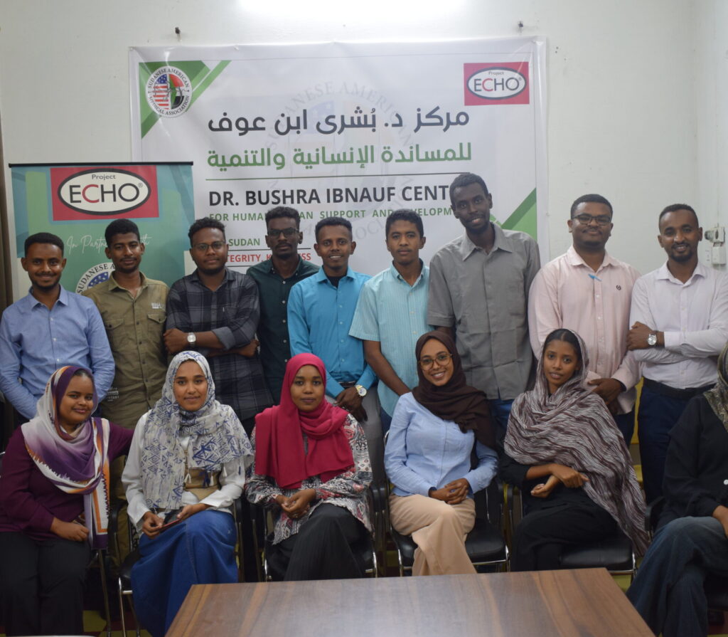 Group photo of Learners and participants posing indoors at the Dr. Bushra Ibnauf Center for Humanitarian Support and Development.